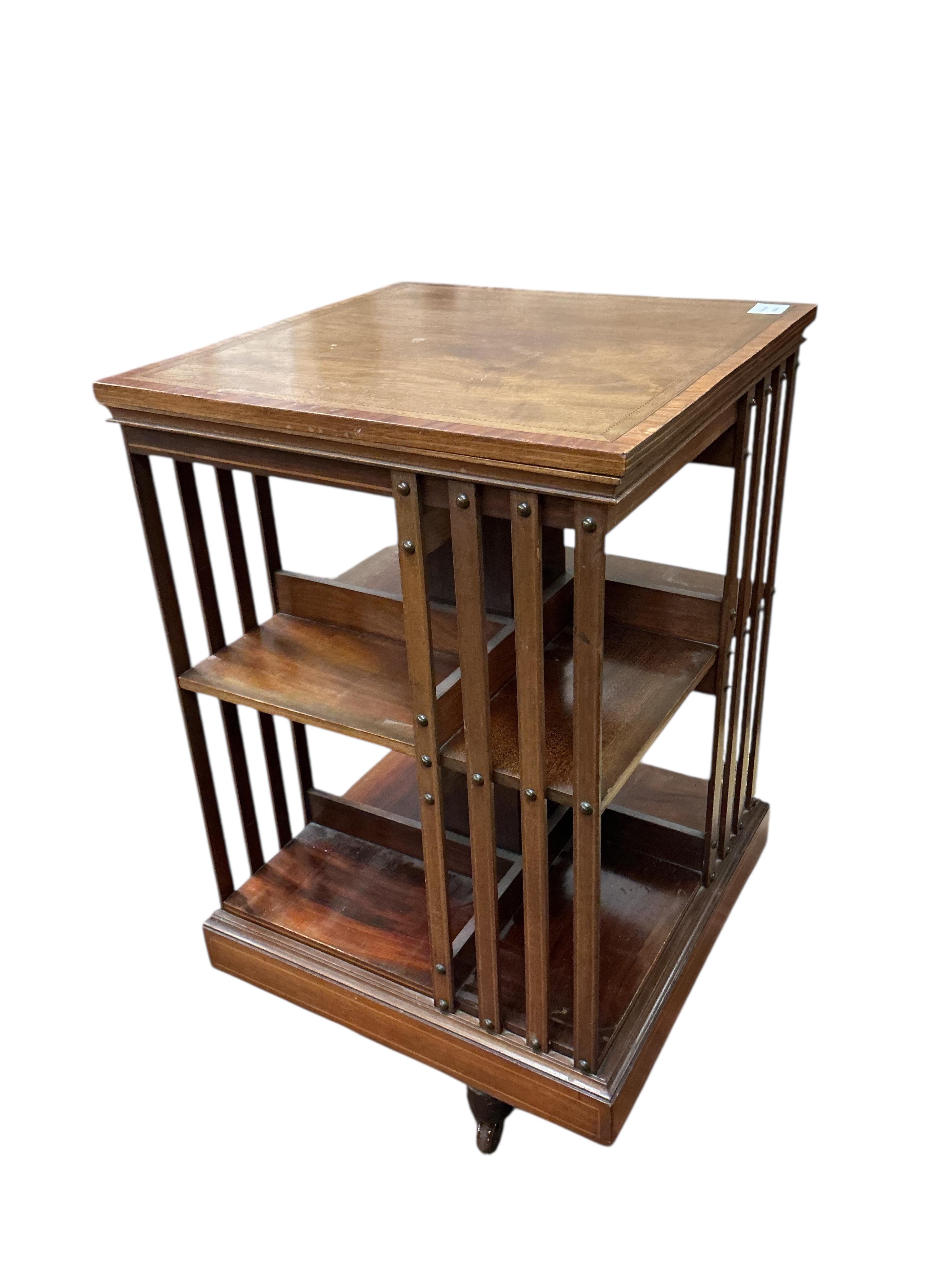 An Edwardian inlaid mahogany revolving bookcase, width 49cm, depth 49cm, height 86cm
